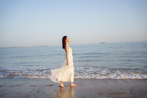 Female tourist walking on the beach