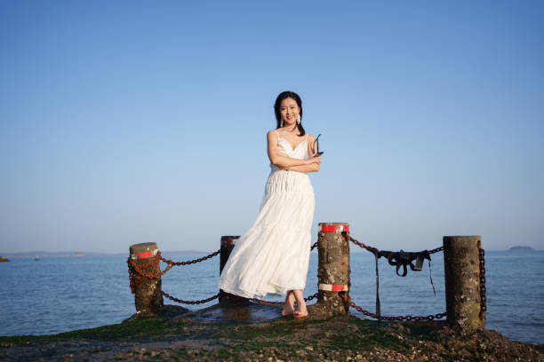 Beautiful woman standing on the beach