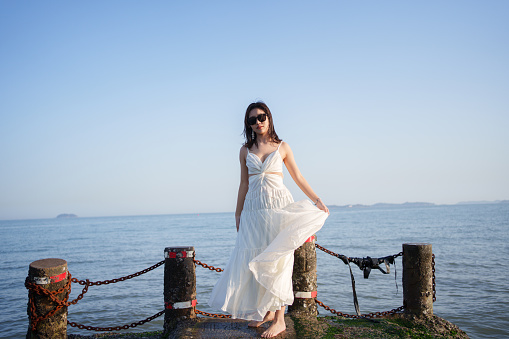 Female tourist standing at the beach