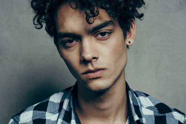 istock cute guy plaid shirt cropped view studio close-up 2083178962