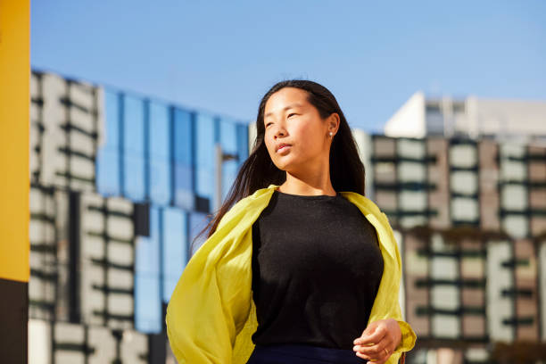 istock Urban Success: Young Asian Entrepreneur's Confident Stance on the Financial District's Edge 2083196637
