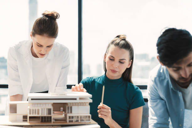 istock Professional architect team working together to design house model. Tracery. 2083216719