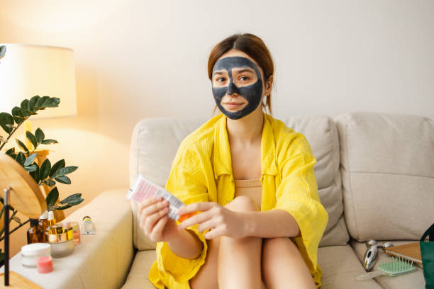 istock Skin Care Routine: Woman Applying Moisturizer at Home 2083231726