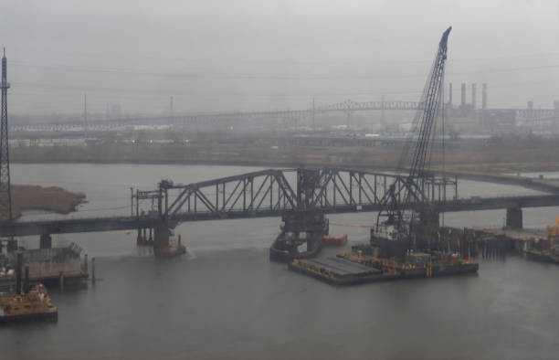 View over the Hudson river from the New Jersey turnpike.  This is on a very wet and dark spring day with mist over the industrial area on the river.