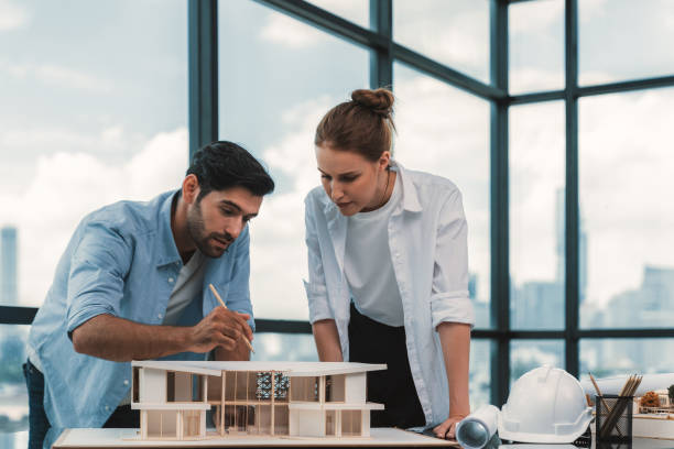 istock Smart architect engineer team working together to measure house model. Tracery. 2083240172
