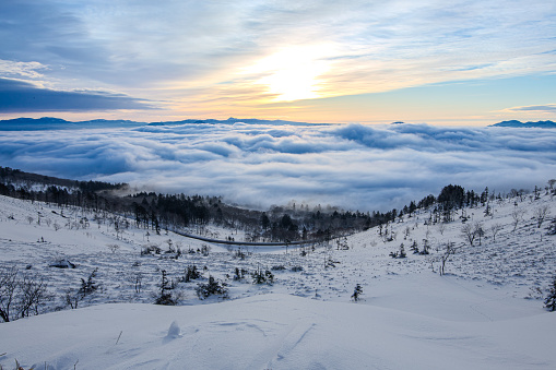 Dramatic and dynamic morning winter view of a sea of clouds.