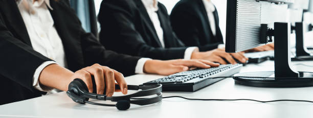 istock Call center wearing headset working in office for customer support oratory 2083264709