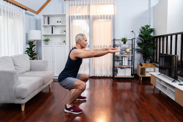 istock Active and fit senior man warmup and stretching before home exercising. Clout 2083269130