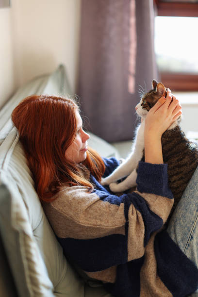 istock girl talk with her cat 2083273896