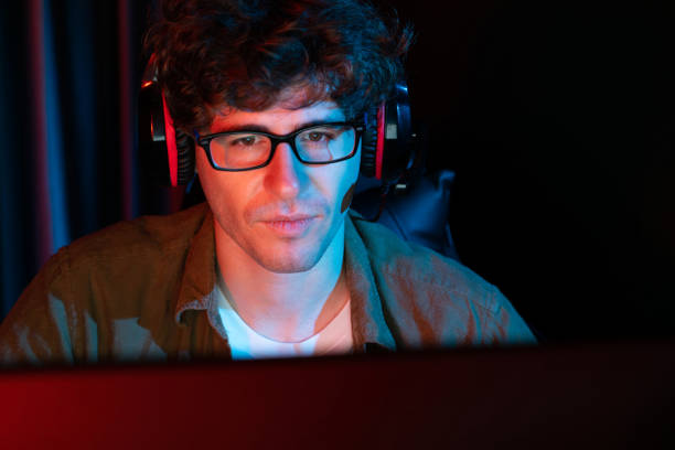 istock Streamer concentrated with Esport team on computer with harder game. Gusher. 2083289109