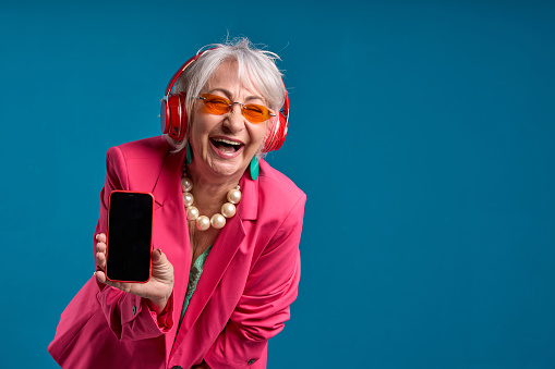 Joyful Senior Woman Sharing Smartphone Screen