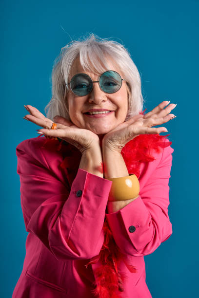 istock Charming Senior Lady in Stylish Pink 2083330642