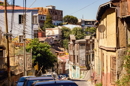 Valparaiso cityscape, colorful houses in Valparaiso, Chile. Old house with a spire against blue sky