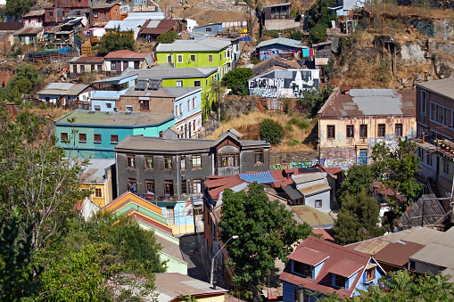 Valparaiso cityscape, colorful houses in Valparaiso, Chile. Old house with a spire against blue sky