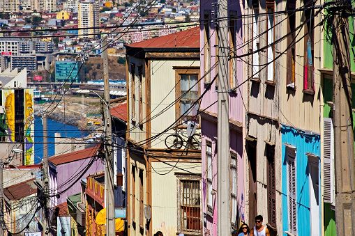 Valparaiso cityscape, colorful houses in Valparaiso, Chile. Old house with a spire against blue sky