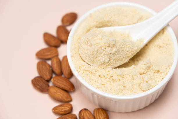 istock Almond flour and almonds on a beige background 2083375557