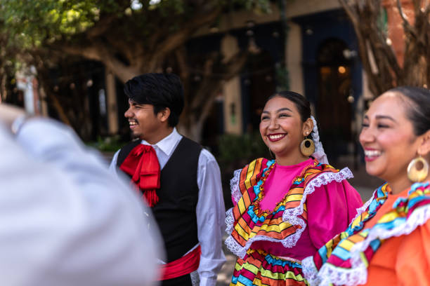 istock Traditional Mexican dancers talking outdoors 2083392891