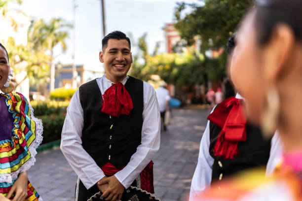 istock Traditional Mexican dancers talking outdoors 2083393436