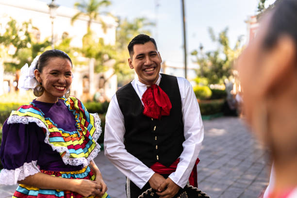 istock Traditional Mexican dancers talking outdoors 2083393441