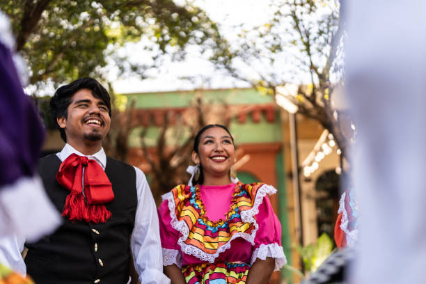 istock Traditional Mexican dancers talking outdoors 2083393443