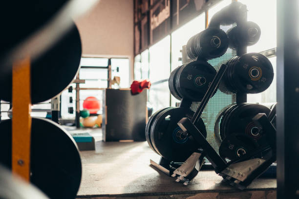 istock Young fitness instructor training in a gym, muscular trainer 2083396170