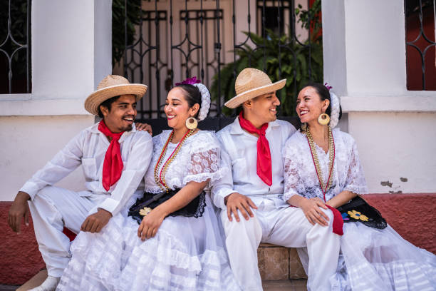 Traditional Mexican dancers talking outdoors