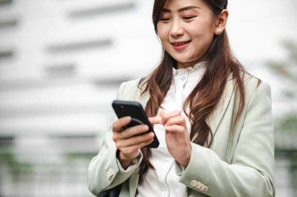 istock Morning Messages: Cheerful Businesswoman's Commute Companion 2083409561