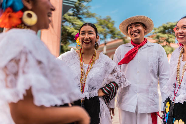 istock Traditional Mexican dancers talking outdoors 2083409569