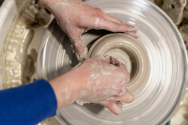 Young woman in pottery workshop