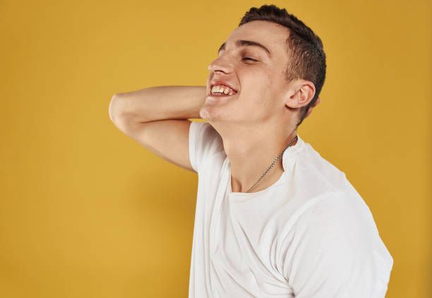 istock Joyful man gesturing with his hands on yellow background cropped view 2083448291