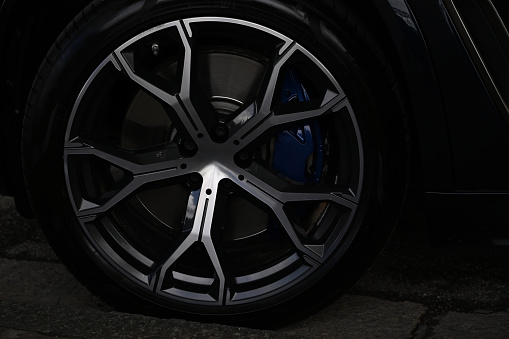 Sports car wheel detail with brake pads