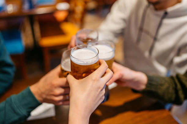istock Young Group Of Friends Cheering With Beer In A Pub 2083465053