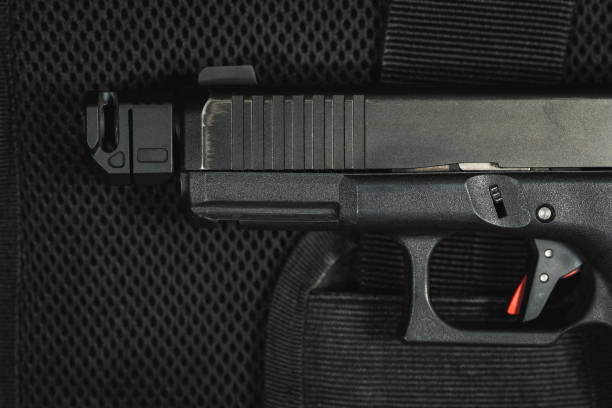istock Modern 9 mm pistol with a muzzle brake, close-up photo. 2083475959