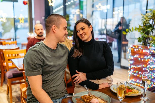 young couple eating belgian waffles and drinking champagne in a pub - waffle eating meal food and drink zdjęcia i obrazy z banku zdjęć