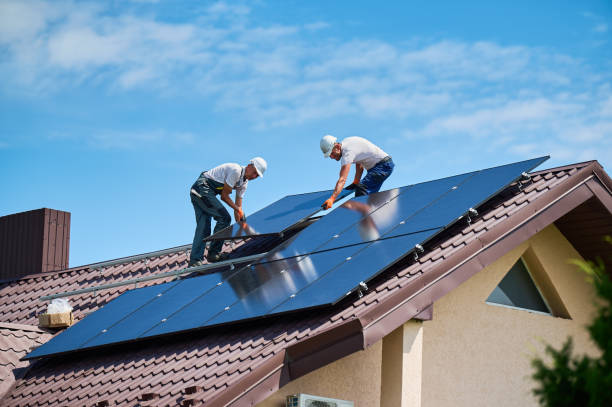 istock Workers building solar panel system on roof of house. Men installing photovoltaic solar module 2083478173