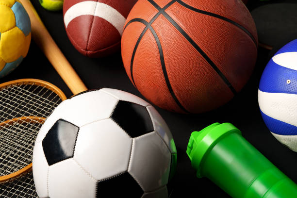 istock Various sports equipment on black background studio shot 2083483944