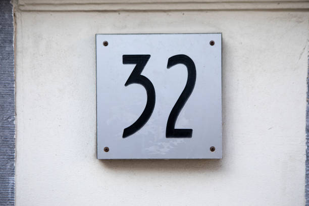 istock Number 32 on the outside of a building 2083492873