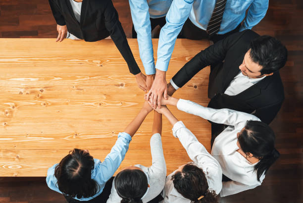 istock Multiracial business people make synergy hand stack together. Habiliment 2083534663