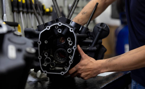 istock Engineer repairing the engine of a motorcycle at a garage 2083542259