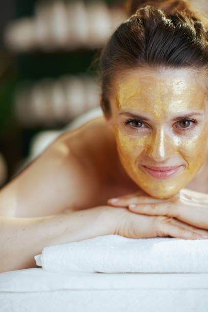istock relaxed modern woman in spa salon laying on massage table 2083562426