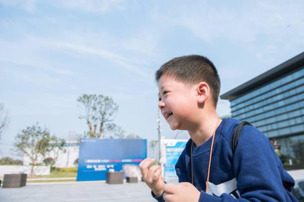A cute little boy laughed happily