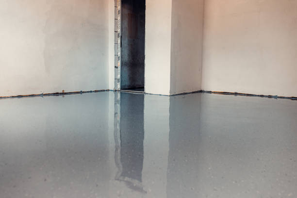 istock apply grey epoxy resin in an industrial hall 2083622452