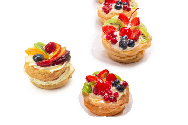 Home made cake with cream and fruits isolated on white.