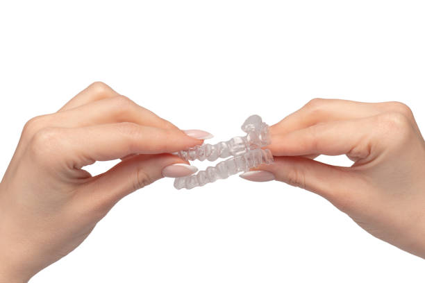 istock Transparent mouth guard in a woman's hand isolated. 2083625664