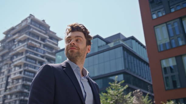 istock Successful businessman texting message on smartphone walking street close up. 2083629283