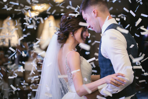 istock Happy wedding couple performs the first dance in a restaurant. Romantic moments 2083654736