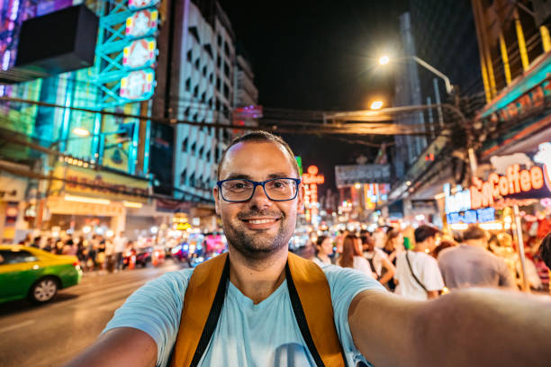 istock Young Man Taking Selfies In Chinatown In Bangkok At Night 2083659977