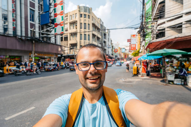 istock Young Man Taking Selfies In Chinatown In Bangkok 2083661009