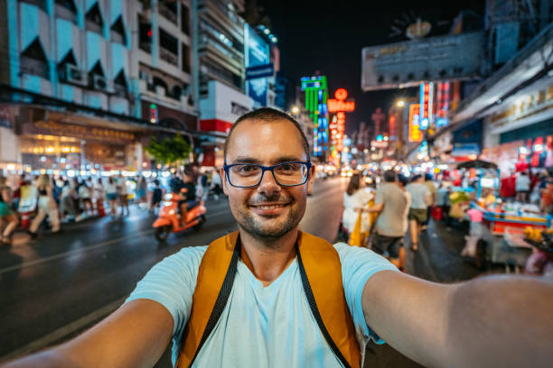 istock Young Man Taking Selfies In Chinatown In Bangkok At Night 2083663165