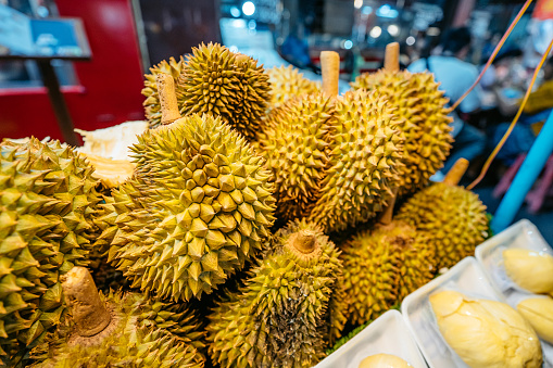 Durian fruit being sold on the street market in Bangkok in Thailand.